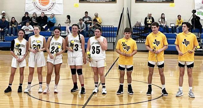 MHS SENIOR BASKETBALL PLAYERS were recognized Tuesday night when the Jackets faced off against Santa Anna. The Lady Jackets smoked the Lady Mountaineers 59-21 to finish out their season as Co-District Champions. The boys came from behind to also beat Santa Anna 45-31. Senior players pictured left to right: Hailey Ruiz, Cozette Halley, Makinley Kothmann, Zoe Castleberry, Kristen Portilla, Kade Rayburn, Wyatt Terrell, Aydan Wilson. Jessica Rayburn, photo.