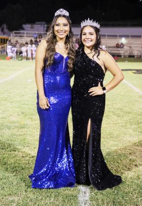 LEFT- Nadia Garcia, Band Sweetheart, and Football Queen Tatum Ruiz pose together following the crowning at halftime of Friday's Homecoming game. Read about the girls and their court on page 8. Laressa Brown, photo.