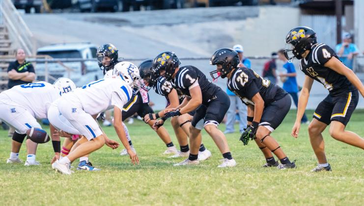 SITTIN’ ON GO- JV Jacket defense lines up against Eden in Menard’s win on Thursday, Oct. 15, 2026. The game was called in the second quarter due to lightning, with Menard up 16-0. Left to right: Brayden Ramon, Dawson Nicholas, Ashton Martin, Easton Sanchez, River Salas.