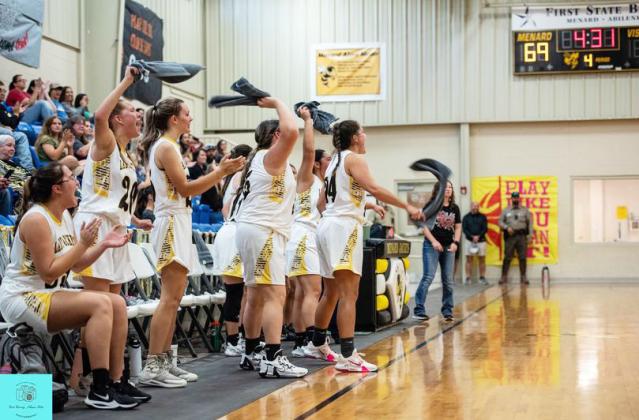 The Lady Jacket bench cheers their teammates on the court during a decisive at home win over Iraan Saturday. Sandy Kothmann, photo.