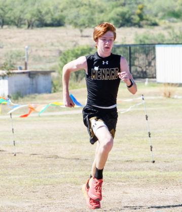 Freshman Bryce Davis, pictured left at the district cross country meet last week, was Menard’s top finisher at the regional contest on Tuesday. Davis placed 83 out of 135 runners. Photo by Nora Davis.