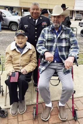 RET/SFC Anastacio (Butch) Aguilar, pictured back, lead Saturday’s Veterans day Parade parade in a military jeep. He was accompanied by Mr. William Potter, left, who is Menard’s oldest living veteran at (nearing)102 years old. Potter served in WWII. Pictured right is veteran Mr. Carl Kothmann. Courtesy photo.
