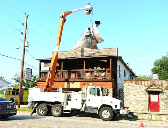 CLEANUP REMAINS UNDERWAY in nearby London following forceful wind and a deluge of rainfall last week. The London Grocery &amp; Grill suffered possibly the most damage, and left a home and business uninhabitable. Courtesy photo.