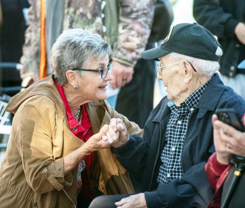 'THANK YOU.' Mrs. Dreu Bearden takes a minute to visit with WWII veteran Bill Potter in American Legion Park after Saturday's parade. See additional photos on page 8. Sandy Kothmann, photo.
