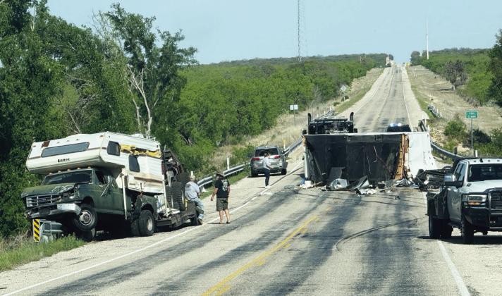 Various debris was strewn across SH 29 Sunday afternoon, after a travel trailer being towed by an SUV started swerving, then toppled. Photo courtesy MCSO.