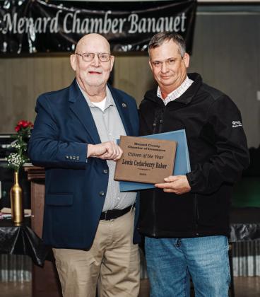 MODEL CITIZEN- He may not be a model, but he is a very generous and hard working citizen of Menard. Lewis 'Cedarberry' Baker, right, accepts his 2025 Citizen of the Year Award from Chamber of Commerce director Dean Mayhew, left. R. Guerrero, photo.