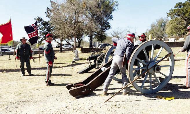 Preparing the cannon at the 2022 Civil War veteran memorial program are Gary Bates, Buck Bostick, Danny Masters, and Wayne Carlile. The 6-pound cannon fired during the veteran recognition at Pioneer Rest Cemetery was originally used in the 1960 movie “The Alamo.” The canon will be included again at this year's remembrance on Saturday. Courtesy file photo.