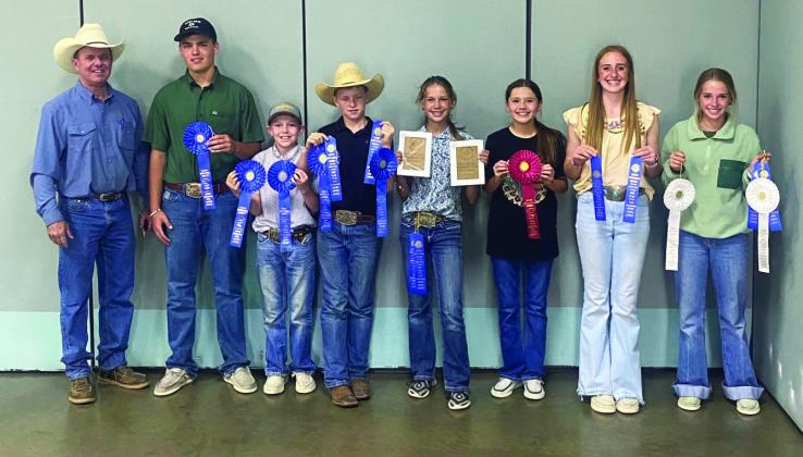 Menard’s Wool and Mohair judging teams (l to r): Coach Jason Bannowsky, Cado Bannowsky, O’Dan Wright, Kade Bannowsky, Channing Chambless, Kate Baker, Mackenzie Wright, and Taytum Chambless. Courtesy photo.