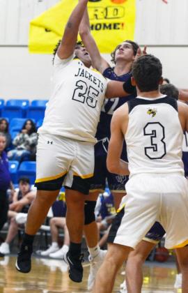 LEFT- Zadrian Zapata (25) jumps for a ball. Joel Guerrero looks on.