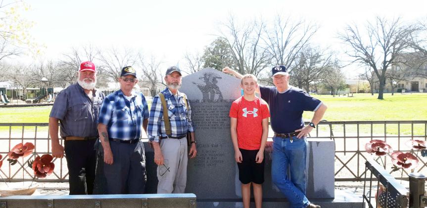 Members of Menard's Sons of Confederate Veterans (SCV) Camp 2326 cleaned the veteran monuments at American Legion Park earlier this year. Pictured left to right: Barry Kniffen, Eddie Bostwick, Gary Bates and grandson Seth Bates, and Terry Kelley. The local SCV is one of several organizations who readily take part in preserving the history of Menard County veterans by maintaining memorials and cemeteries, holding ceremonies, and marching in the annual PTO Veterans Day Parade each November. Courtesy photo.