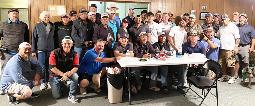BELOW- Golfers who participated in the 8th Annual Sacred Heart Catholic Church golf tournament gather for a group picture after a long day of golf. The tournament hosted a record 25 teams and was deemed a success. Courtesy photo.