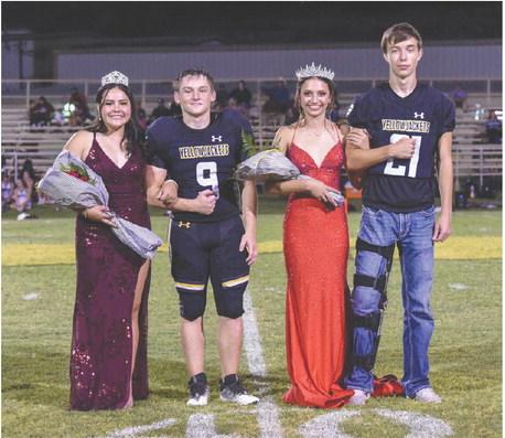 THIS IS HOW WE DO IT- Freshly-crowned Band Sweetheart Tatum Ruiz, far left, was escorted by Hunter Whitaker on Friday at Menard's Homecoming. Football Queen Hailey Ruiz and her escort Colby Powell joined them midfield following the halftime crowning ceremony. You can read more about the Sweetheart, Queen, and the entire court on page 10. Nora Davis, Photo.