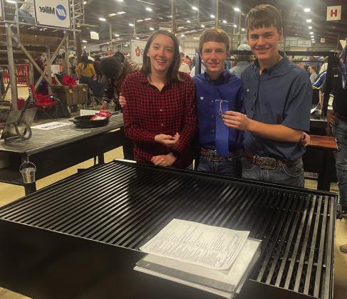 ABOVE- Freshmen Katherine Russell, Bryce Davis, and Cado Bannowsky scored a blue ribbon with their barbecue pit project. Courtesy photo.