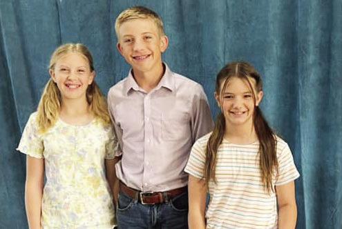 ABOVE- Caitlyn Burch, Benjamin Burch, Claire Corbin.