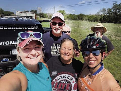 RIDING FOR A CAUSE-Local 15 year cancer survivor, Molly Jack Moser Waldrop, flanked by, Capt. Jennifer Kennedy and Sgt. Christian Laflour with Sgt. Ronnie Mascheck, Lt. Wayne Kennedy (hiding), and Richard Hernandez in the background. Sgt. Kennedy has carried tags in honor of Molly for many years. Courtesy Photo.