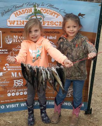 A pair of very excited young fisherwomen with their bounty thanks to a WinterFisch event. Courtesy photo.