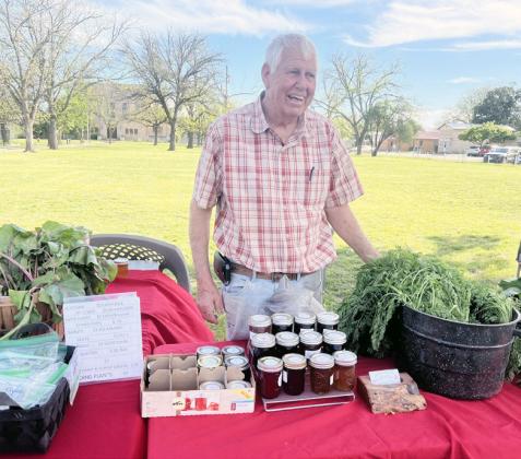 Market vendor Billy Kniffen with his BMK Farms wares of fresh veggies and homemade jams.