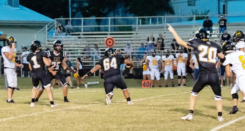 CLEAR THE WAY- Senior Zeke Hernandez, #64, moved the Jackets 9-yds closer to the end zone-after his interception during Menard's 57-25 win over the Blanket Tigers last Friday. Ashton Martin (1), Cado Bannowsky (25) and Bryce Davis (20) cheer him on. The Jackets, now 1-0, travel to Rochelle Friday for a 7:30 p.m. kickoff. See more photos on our Jacket Backers page, page 8. Nora Davis, photo.