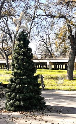 ABOVE- One of several Christmas trees at the low water crossing park sits among the other decor and lights. .
