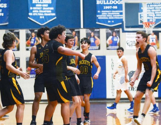 TEAMWORK- Yellowjackets celebrate in their win over Eden on Tuesday night. Left to right: Kade Rayburn, Isaiah Stanislawski, Zadrian Zapata, Roy Brown, Orlando Resendiz, and Joel Guerrero. Sandy Kothmann, photo.
