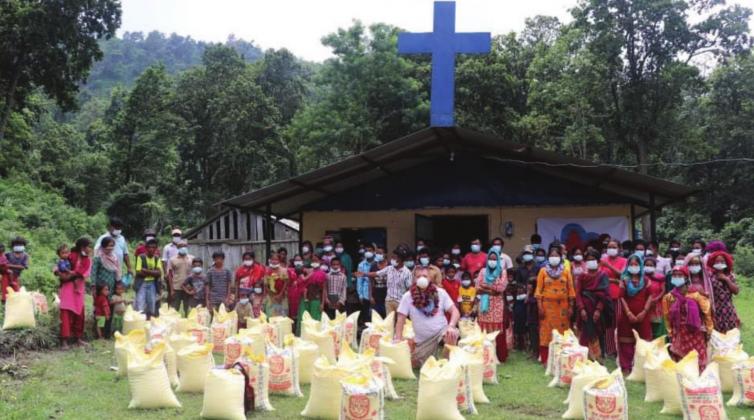 Food and Holy Bibles were distributed in a Christian church located in west Nepal. The bibles were printed in Nepalese and English.