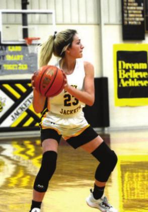 Freshman Korah Mayfi eld looks for an open man in the fast paced game against 2A San Saba.