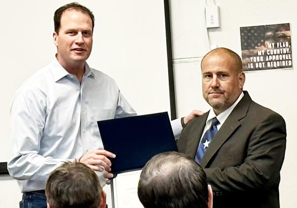 ABOVE AND BEYOND- Menard County Emergency Management Coordinator Jeff Whitson, right, accepts a certificate of appreciation from Congressman August Pfluger. Whitson was recognized for his consistent work ethnic and willingness to go above expectations when needed. Courtesy photo.