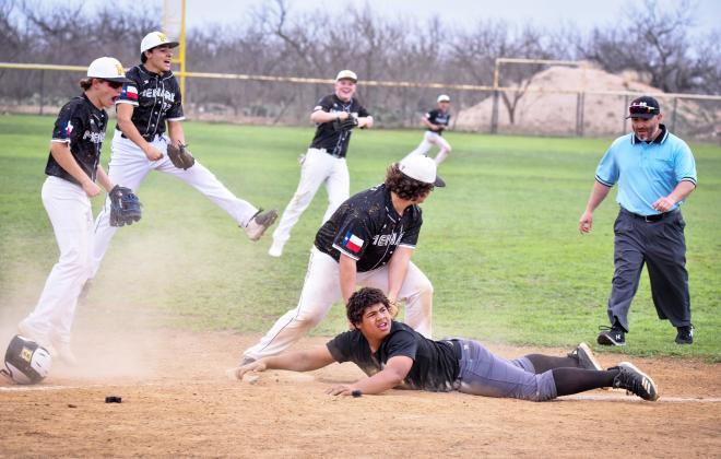 YOU'RE OUTTA HERE! Madolyn Nasworthy captured this great shot of Yellowjacket Jadon Torres, center, as he tags out a Brady JV runner trying to steal third during a Ranch Ball Tournament match-up in Menard last weekend. Jacket teammates Kade Rayburn, Jay Guerrero, Tate Wagner, and Hunter Whitaker celebrate the play as umpire David Sanchez moves in to confirm.