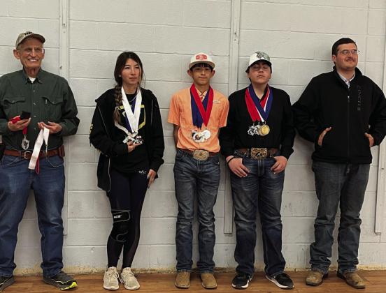 Heart of Texas Indoor Match participants and coaches sporting their newly earned hardware (l to r)– Coach David Hand; Mia Estrada; Mason Mireles; Dawson Nicholas; and Assistant Coach and Texas State Games Champion Larkin Loeffler. Courtesy Photo.
