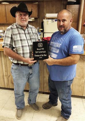 Menard Fire Department president Skeet Rogers, left, presents Jeff Whitson his plaque for the department's 2022 “Fireman of the Year.' Jeff is also the Menard County Emergency Management Coordinator and Assistant Fire Chief. He is very involved in the operation and success of the fire department. Photo by Jim Wright.