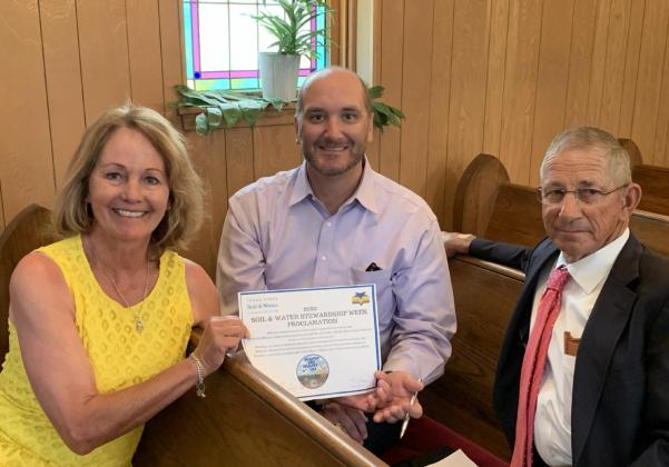 STEWARDSHIP PROCLAMATION- Judge Brandon Corbin (center) signed the Stewardship Week Proclamation for Menard County. Judge Corbin is pictured with Susie Lyckman and Menard County Soil and Water Conservation Board Chairman Benny Kothmann.
