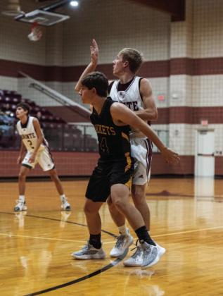 Junior Kade Rayburn blocks out a Bronte Longhorn.