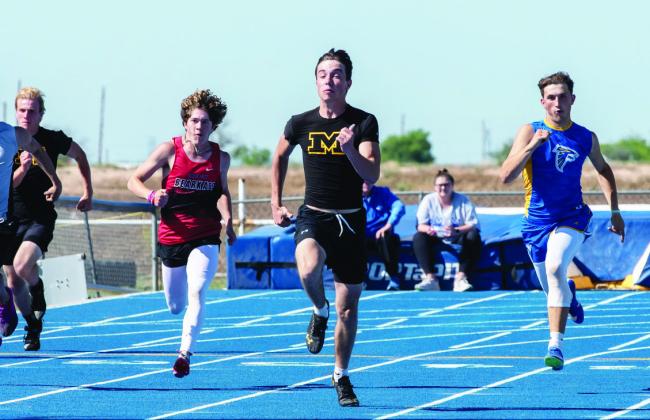 LEFT- Senior Colby Powell tears down the homestretch of his gold medal winning 200m dash at the Area meet. Powell also placed 2nd in the 100m dash, and qualifies for the Regional meet in those events, plus the 4x100m relay. Nora Davis, photo. View additional Area track photos and more by Nora Davis: