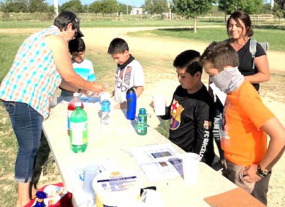 Mary Kniffen, left, teaches how aquifers work using an “Edible Aquifer” program during the 4th &amp; 5th grade Conservation Field Day on Wednesday, September 8, 2021. Courtesy photo.