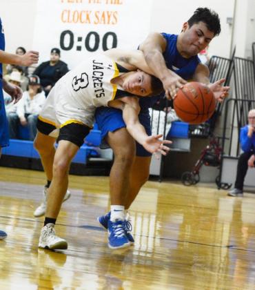 ABOVE- Joel Guerrero practices a complicated yoga pose as he fights for the ball against Eden.