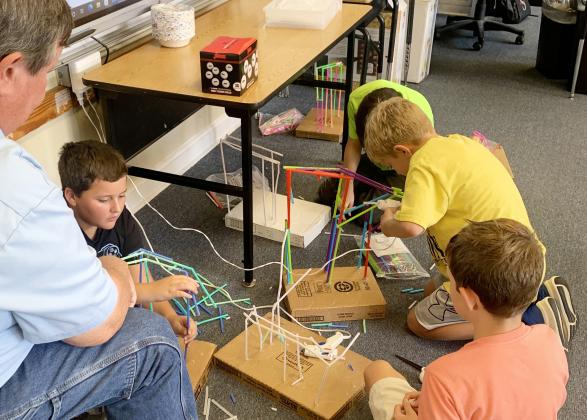 STEM FUN- Menard Elementary 4th and 5th graders have spent the week completing a special STEM (Science, Technology, Engineering and Math) project in their science class with Ms. Wynne Simon. The students were tasked with building roller coasters for a ping pong ball using drinking straws. Parents and guardians were encouraged to attend a class to encourage and assist their student. TMN photo.