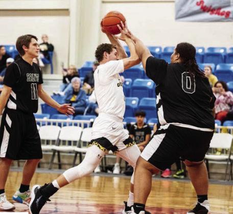 Senior Wyatt Terrell, center, tries to work through the San Angelo Saints defense.
