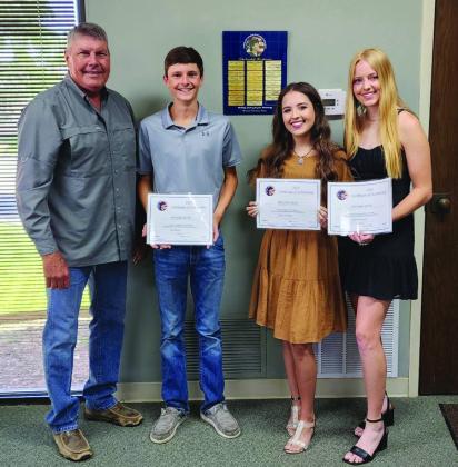 MENARD BANK SCHOLARSHIP RECIPEINETS- pictured with Menard Bank President Monte Lyckman (l to r) Roy Brown, Aminy Anderson, and Addy Bannowsky.