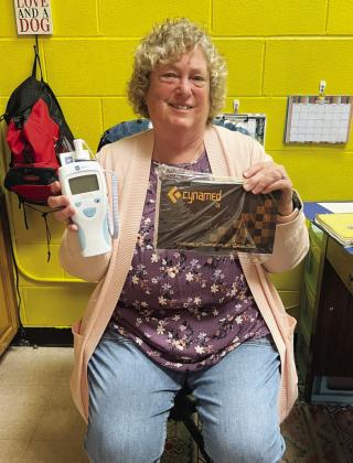 School nurse Norma Hitt displays the thermometer and otoscope Frontera Healthcare employees recently donated, reinforcing the clinic's commitment to supporting local communities and improving access to essential healthcare resources. TMN photo.