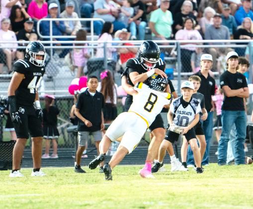 Mack Davis jumps on a Water Valley ballcarrier in Menard’s big 65-37 district opening win on Friday, Oct. 9.