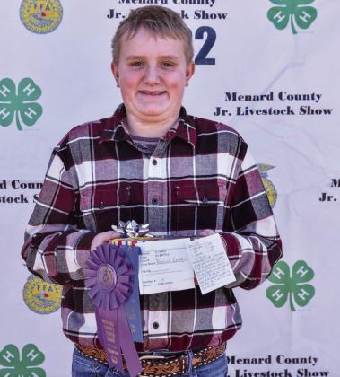 LEFT- At the 2022 county show Cade Corbin won several ribbons for his food entries. That effort translated to the sale, earning Cade a few hundred dollars for his college savings account thanks to generous donors. Madolyn Nasworthy, photo.