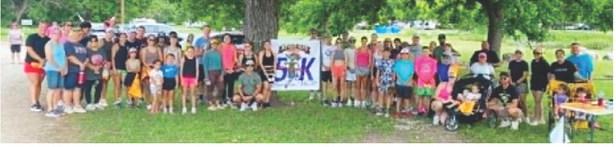 JIM BOWIE DAY 5K participants and volunteers gathered for a group photo on Saturday, June 13, 2026. Courtesy photo.