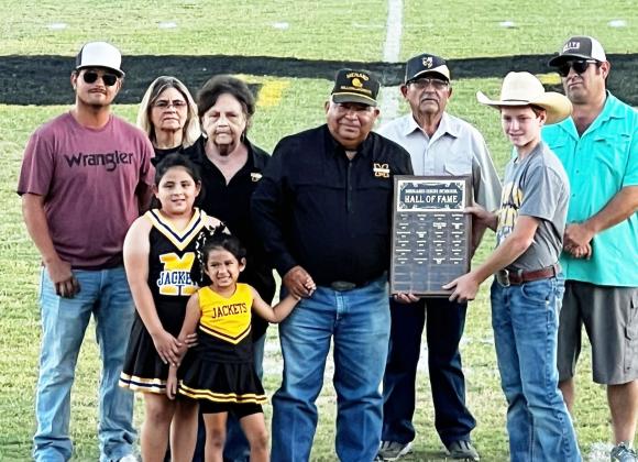 Anastacio 'Butch' Aguilar, center, was inducted into the MHS Hall of Fame last Friday prior to the homecoming football game in Menard. Butch and his wife Glenda are enjoying retirement in Menard. Joining them Friday was (left to right): Anthony Garza, Bea Garza, Glenda and Butch Aguilar, Buddy Garza, MHS student council representative Kade Bannowsky, John Mireles. Front: Hunter Mireles and Charleigh Jo Sue Aguilar. Read more about Butch on page 3. Courtesy photo.