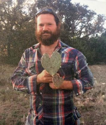 HOUSTON SIMMONS shows his love in a family photo. You can donate in his memory to give back to the local organizations he worked with and cared deeply for.