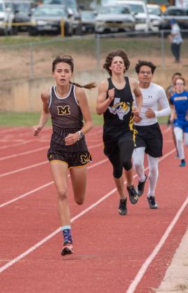 SEE YA- Freshman Lady Jacket Danni Ruiz, pictured left at the Blanket Tiger Relays earlier this season, often ran the 800m at invitational meets with the boys division. Her time applied to the girls race, but running with the boys helped her keep a more consistent, competitive pace. Going into the regional meet this weekend, Danni holds the the second quickest 1A 800m time in the state, along with the fastest (by almost 2 seconds!) 400m time. Nora Davis, photo.