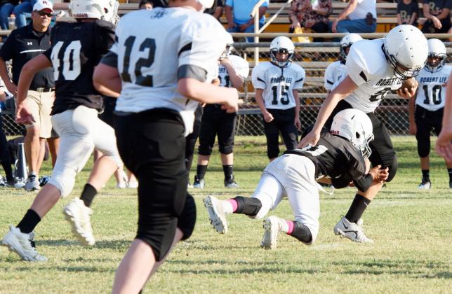 Kade Bannowsky gets horizontal in tackling a Robert Lee ball carrier in a Junior High game earlier this season.