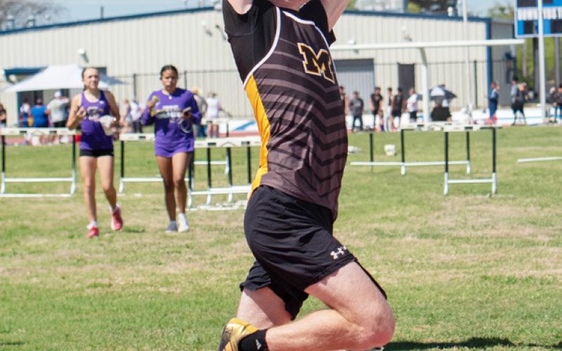 Senior Bryce Davis topped the pole vault podium at district and area, and will enter the regional meet with focused goals including clearing close to 14'. Track photos by Nora Davis.