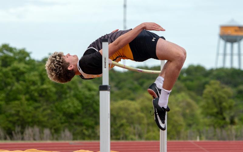 DISTRICT CHAMPION HIGH JUMPER Caden Bounds leaps up and over the bar to win the 1-A dist. 12 boys high jump last Tuesday, April 7. See additional track photos on page 8. Nora Davis, photo.