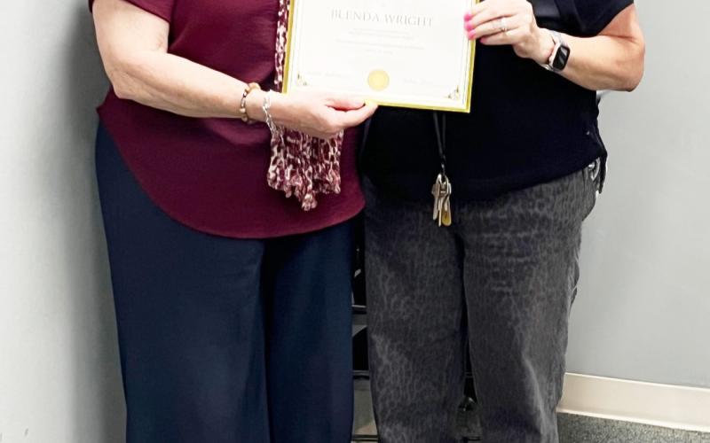 BELOW- Child Welfare Board president Cordelia Kothmann, left, recently presented board member Blenda Wright with a certificate of recognition for her 6 years of service with the organization. TMN photo.