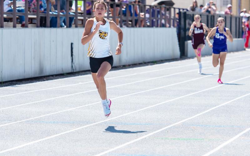 ONE RACE AT A TIME- Two-time defending 400m and 800m state champion Danni Ruiz, pictured below, had a decisive 400m victory at the area meet in Mertzon last week. Danni advanced to the regional meet in the 400m, 800m and 1600m. Nora Davis, photo.